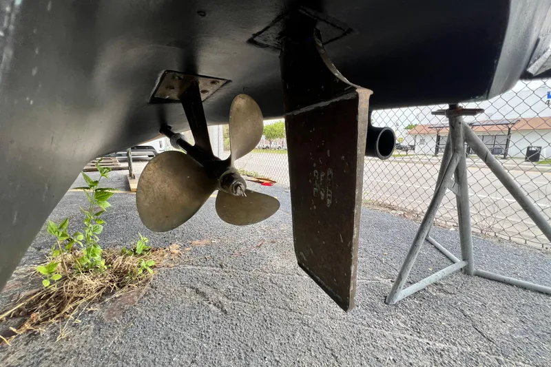 Slide: The Image of Propeller and rudder of 2002 Sea Ray 340 Sundancer on dry dock. - 21