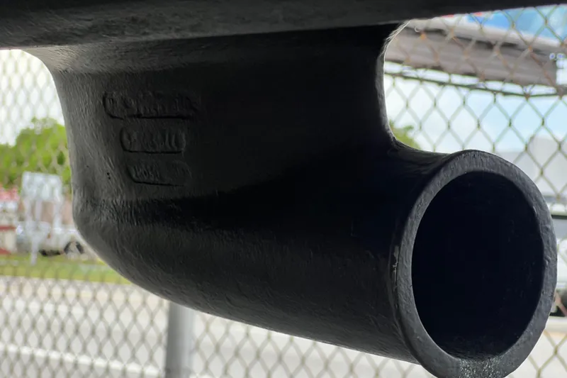 Slide: The Image of Close-up of a 2002 Sea Ray 340 Sundancer exhaust pipe against a chain-link fence. - 22