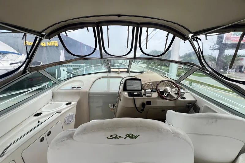Slide: The Image of Interior view of 2002 Sea Ray 340 Sundancer boat cockpit with steering wheel and controls. - 25