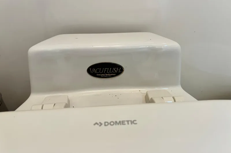 Slide: The Image of Vacuflush toilet system on 2002 Sea Ray 340 Sundancer boat, featuring Dometic technology. - 39