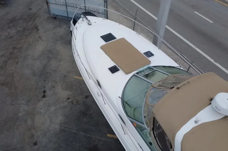Slide: The Image of Aerial view of 2002 Sea Ray 340 Sundancer boat docked near a road. - 4