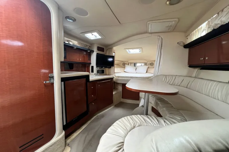 Slide: The Image of Luxurious interior of 2002 Sea Ray 340 Sundancer yacht with cozy seating and modern amenities. - 40