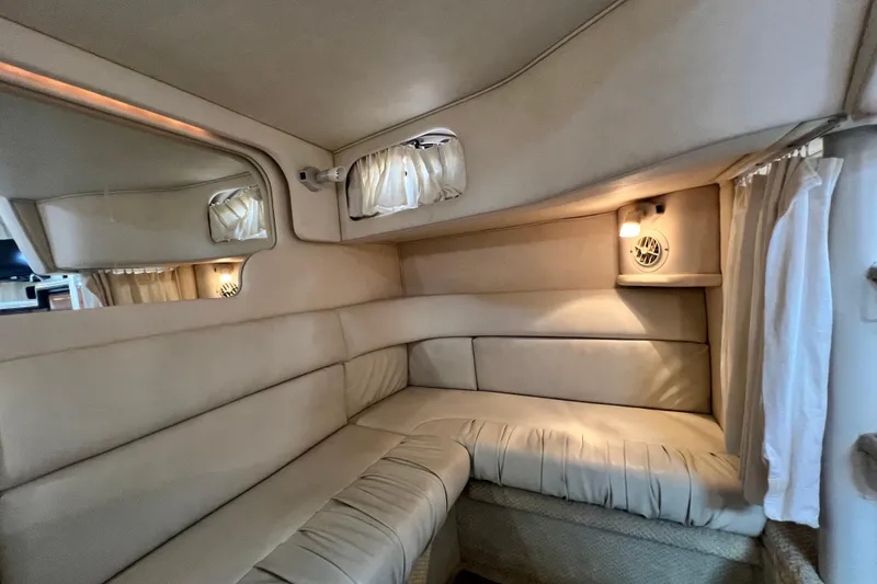 Slide: The Image of Interior cabin of 2002 Sea Ray 340 Sundancer with beige upholstery and ambient lighting. - 44