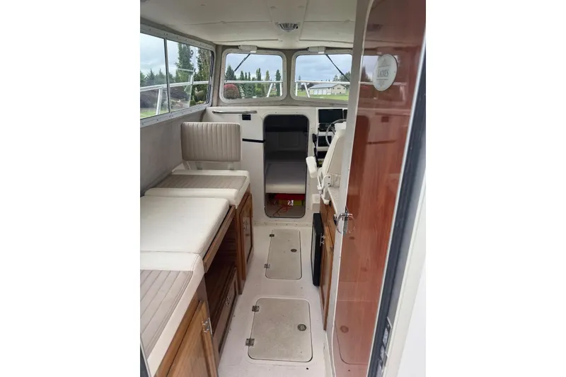 Slide: The Image of Interior of 2020 Defiance San Juan 250 boat with seating and storage. - 17