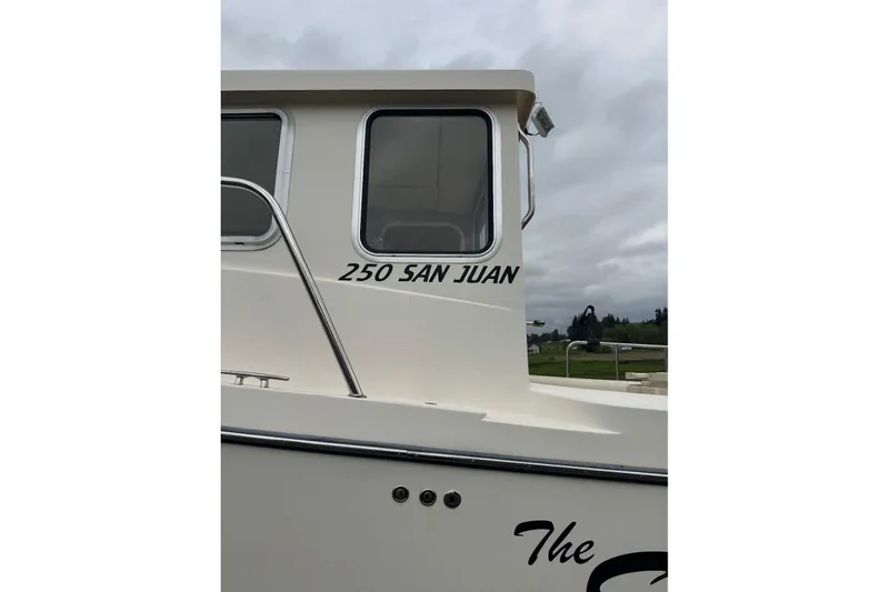 Slide: The Image of 2020 Defiance San Juan 250 boat side view with window and railing. - 5