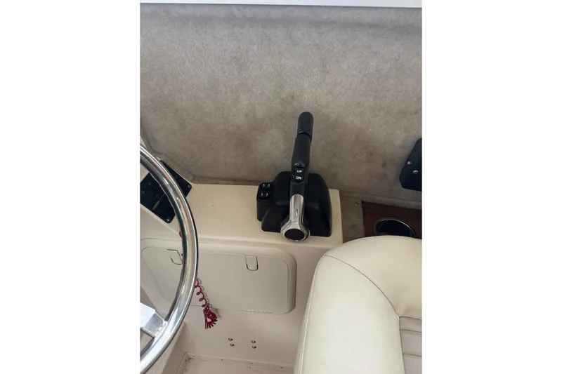 Slide: The Image of Interior of 2020 Defiance San Juan 250 boat showing steering wheel and throttle controls. - 7