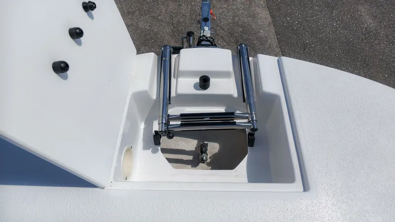 Slide: The Image of A boat with an open storage compartment revealing an anchor winch and ladder. - 19