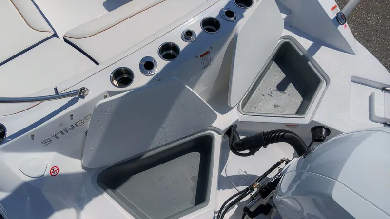 Slide: The Image of The image shows the stern of a Stingray 192 SC boat with multiple cup holders and storage compartments. - 6