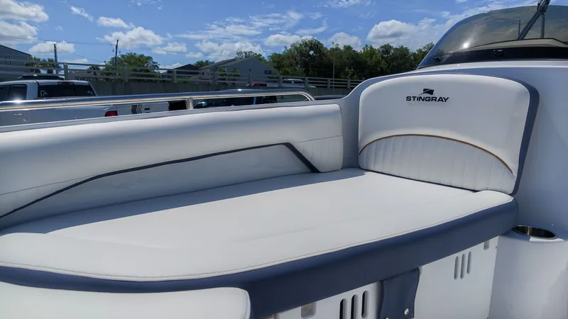 Slide: The Image of The image shows a white seating area on a boat with the "Stingray" logo. - 16