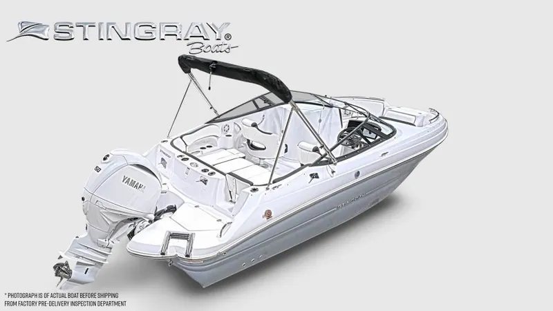 Slide: The Image of 2027 Stingray 211 DC, a sleek white motorboat with an outboard engine. - 6