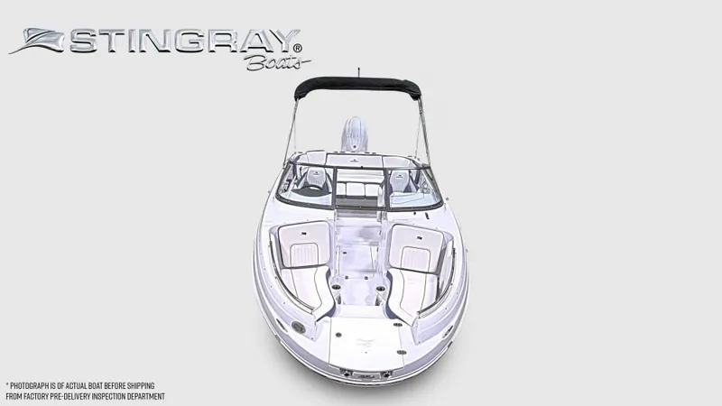 Slide: The Image of Stingray 211 DC from 2027 with open deck and black bimini top. - 7