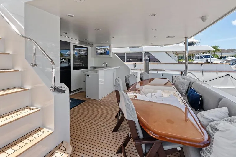 Slide: The Image of Luxurious 2012 Ocean Alexander 90 Skylounge Motoryacht deck with elegant seating and dining area. - 25