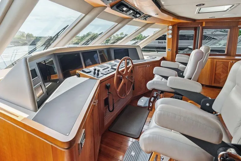 Slide: The Image of Luxurious helm of 2012 Ocean Alexander 90 Skylounge Motoryacht with modern controls and seating. - 42