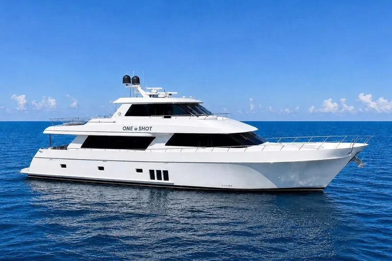 Slide: The Image of 2012 Ocean Alexander 90 Skylounge Motoryacht cruising on open sea under clear blue sky. - 109