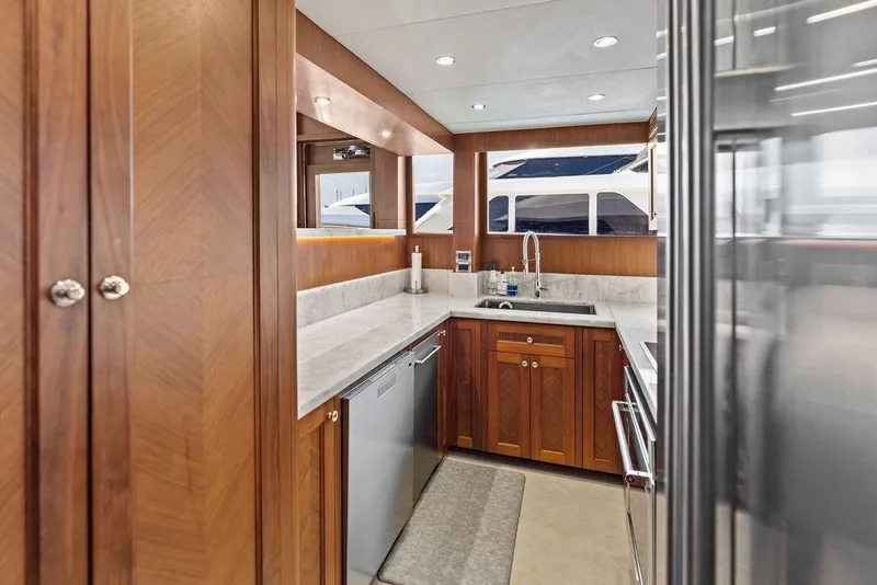 Slide: The Image of Luxurious kitchen interior of 2012 Ocean Alexander 90 Skylounge Motoryacht with wood cabinetry. - 51