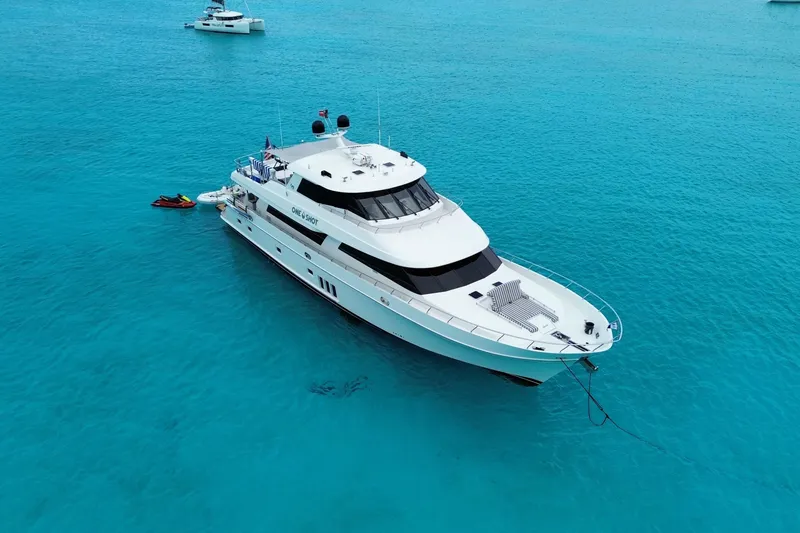 Slide: The Image of Luxurious 2012 Ocean Alexander 90 Skylounge Motoryacht anchored in clear turquoise waters. - 5