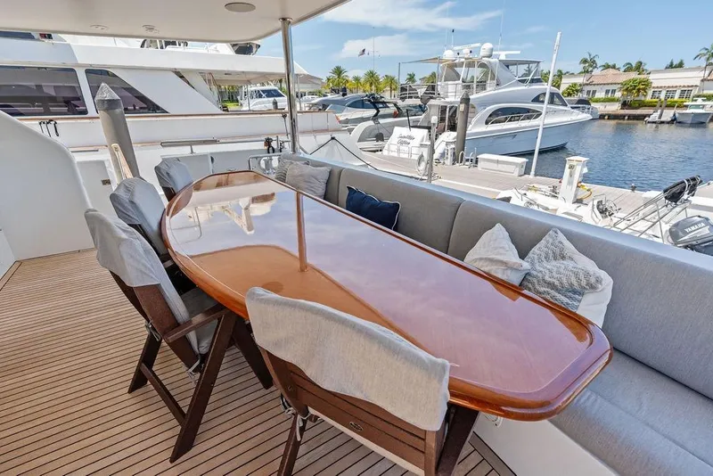 Slide: The Image of Luxurious outdoor dining area on 2012 Ocean Alexander 90 Skylounge Motoryacht. - 14