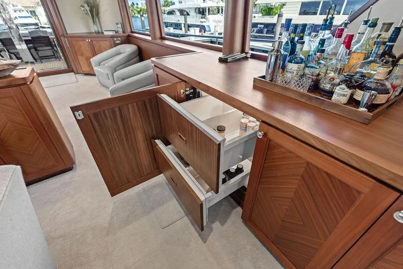 Slide: The Image of Luxurious interior of 2012 Ocean Alexander 90 Skylounge Motoryacht with bar and storage. - 60