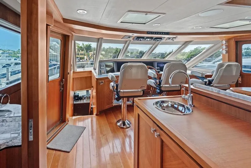 Slide: The Image of Luxurious interior of 2012 Ocean Alexander 90 Skylounge Motoryacht with helm and seating area. - 35