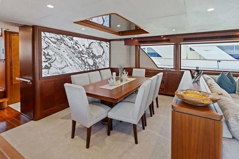 Slide: The Image of Luxurious dining area in 2012 Ocean Alexander 90 Skylounge Motoryacht with elegant decor. - 57