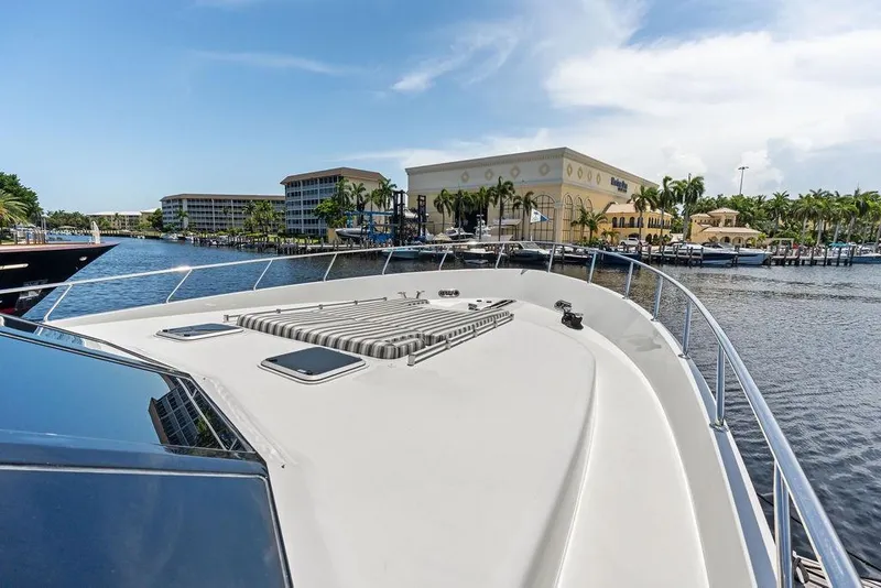 Slide: The Image of 2012 Ocean Alexander 90 Skylounge Motoryacht docked near waterfront buildings. - 20