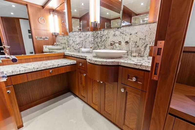 Slide: The Image of Luxurious bathroom in 2012 Ocean Alexander 90 Skylounge Motoryacht with elegant wood cabinetry. - 77