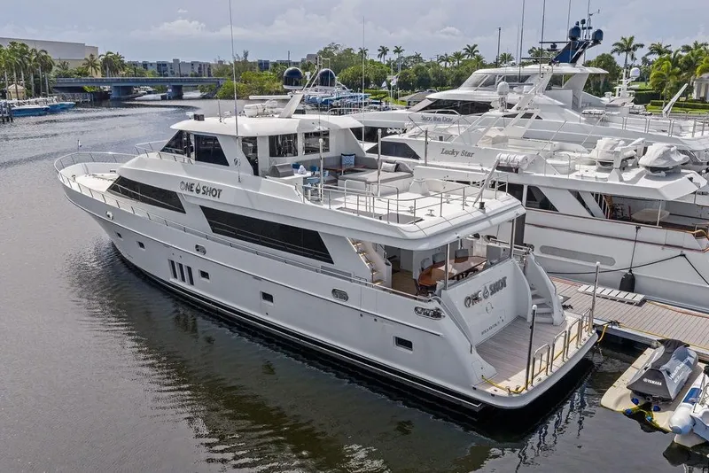Slide: The Image of Luxurious 2012 Ocean Alexander 90 Skylounge Motoryacht docked in a serene marina setting. - 6