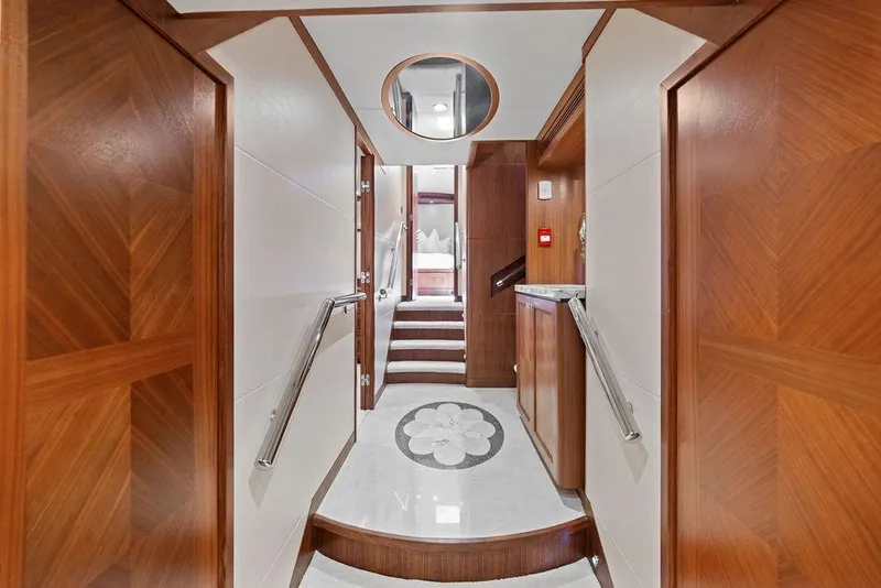 Slide: The Image of Luxurious interior hallway of 2012 Ocean Alexander 90 Skylounge Motoryacht with elegant wood finishes. - 68