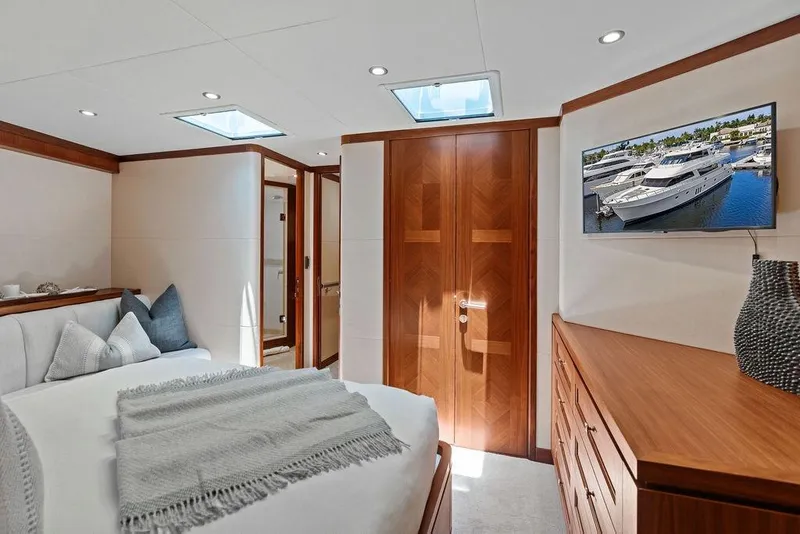 Slide: The Image of Luxurious bedroom interior of 2012 Ocean Alexander 90 Skylounge Motoryacht with elegant wood finishes. - 88