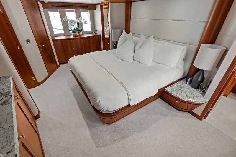 Slide: The Image of Luxurious bedroom in 2012 Ocean Alexander 90 Skylounge Motoryacht with elegant wood finishes. - 71