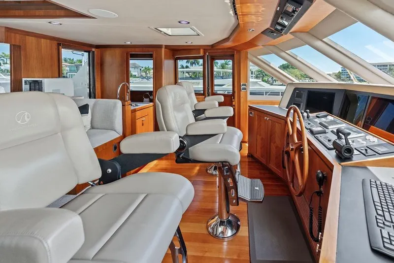 Slide: The Image of Luxurious helm of 2012 Ocean Alexander 90 Skylounge Motoryacht with plush seating and advanced controls. - 40
