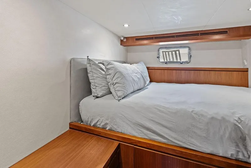Slide: The Image of Luxurious bedroom interior of 2012 Ocean Alexander 90 Skylounge Motoryacht with elegant wood accents. - 94