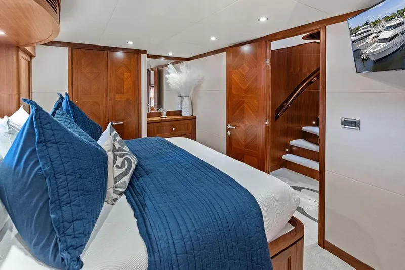 Slide: The Image of Luxurious bedroom interior of 2012 Ocean Alexander 90 Skylounge Motoryacht with elegant wood finishes. - 83