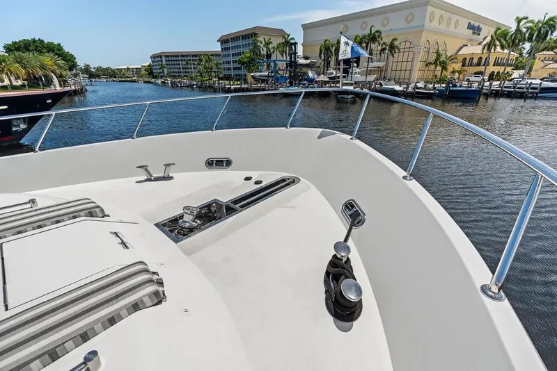 Slide: The Image of Bow view of 2012 Ocean Alexander 90 Skylounge Motoryacht docked by waterfront buildings. - 21