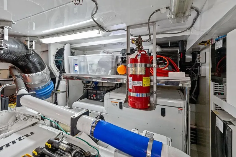 Slide: The Image of Engine room of 2012 Ocean Alexander 90 Skylounge Motoryacht with fire extinguisher and equipment. - 105