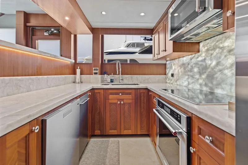 Slide: The Image of Luxurious kitchen interior of 2012 Ocean Alexander 90 Skylounge Motoryacht with modern appliances. - 48