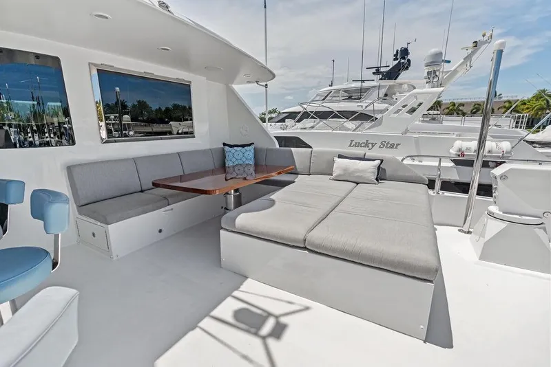 Slide: The Image of Luxurious 2012 Ocean Alexander 90 Skylounge Motoryacht deck with elegant seating and table. - 30