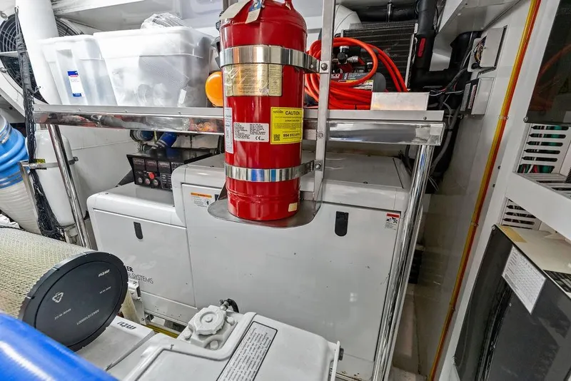 Slide: The Image of Engine room of 2012 Ocean Alexander 90 Skylounge Motoryacht with fire extinguisher and equipment. - 109