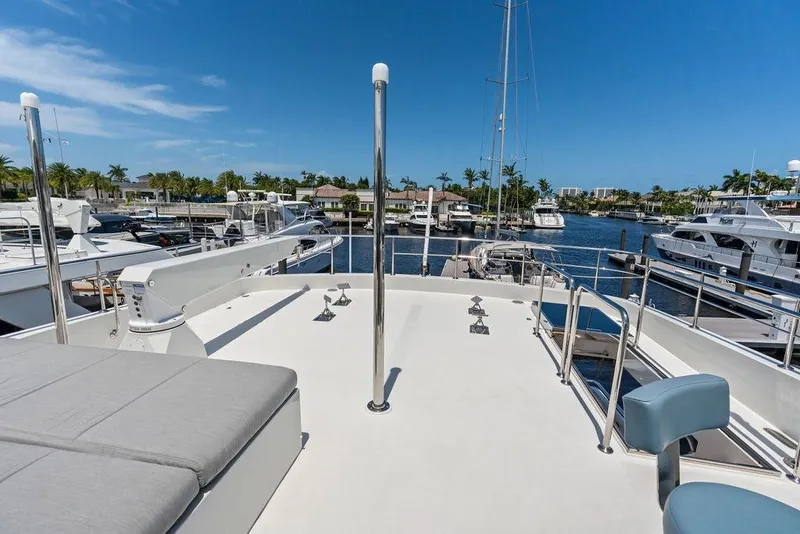 Slide: The Image of Luxurious 2012 Ocean Alexander 90 Skylounge Motoryacht docked in a sunny marina. - 32