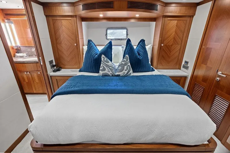 Slide: The Image of Luxurious bedroom interior of 2012 Ocean Alexander 90 Skylounge Motoryacht with elegant wood finishes. - 82