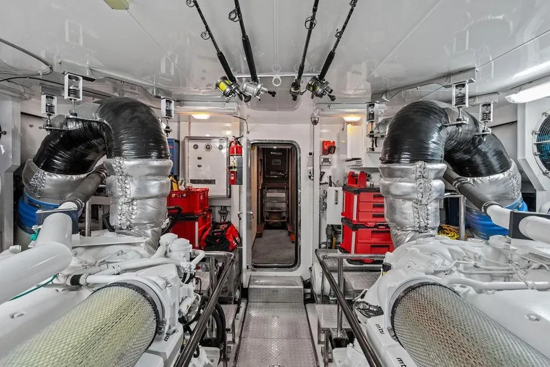 Slide: The Image of Engine room of 2012 Ocean Alexander 90 Skylounge Motoryacht, featuring advanced machinery and equipment. - 106