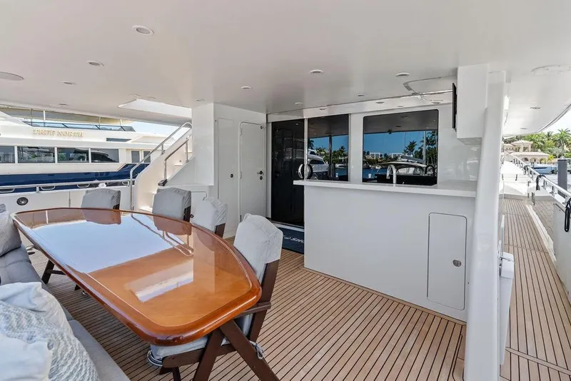 Slide: The Image of Luxurious deck of 2012 Ocean Alexander 90 Skylounge Motoryacht with elegant dining area. - 13