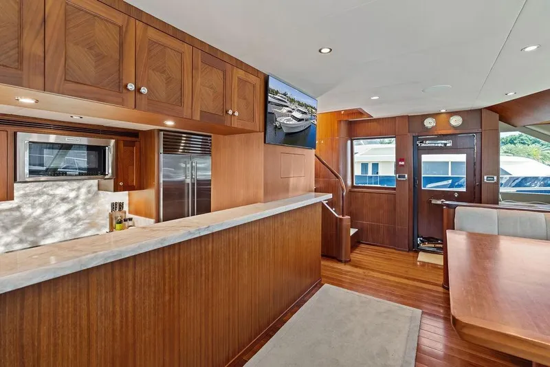 Slide: The Image of Luxurious interior of 2012 Ocean Alexander 90 Skylounge Motoryacht with wood finishes and modern amenities. - 46
