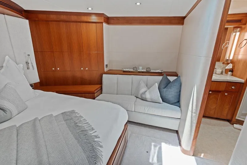 Slide: The Image of Luxurious bedroom interior of 2012 Ocean Alexander 90 Skylounge Motoryacht with elegant wood finishes. - 89