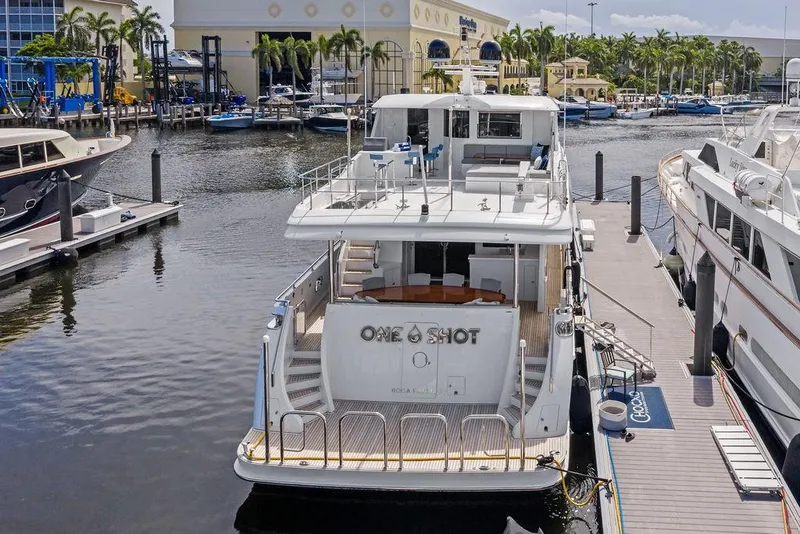 Slide: The Image of Ocean Alexander 90 Skylounge Motoryacht, 2012, docked at marina with palm trees. - 8