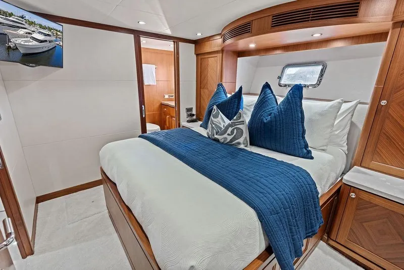 Slide: The Image of Luxurious bedroom interior of 2012 Ocean Alexander 90 Skylounge Motoryacht with elegant wood finishes. - 84