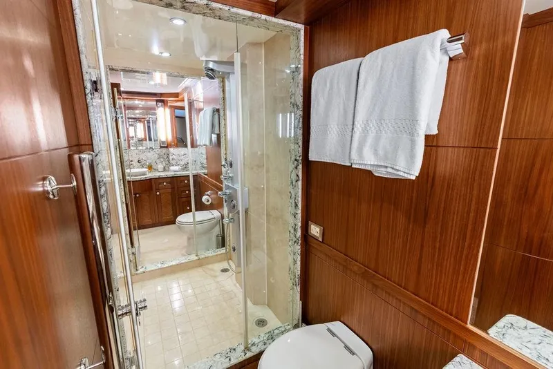 Slide: The Image of Luxurious bathroom in 2012 Ocean Alexander 90 Skylounge Motoryacht with wood accents and marble finishes. - 79