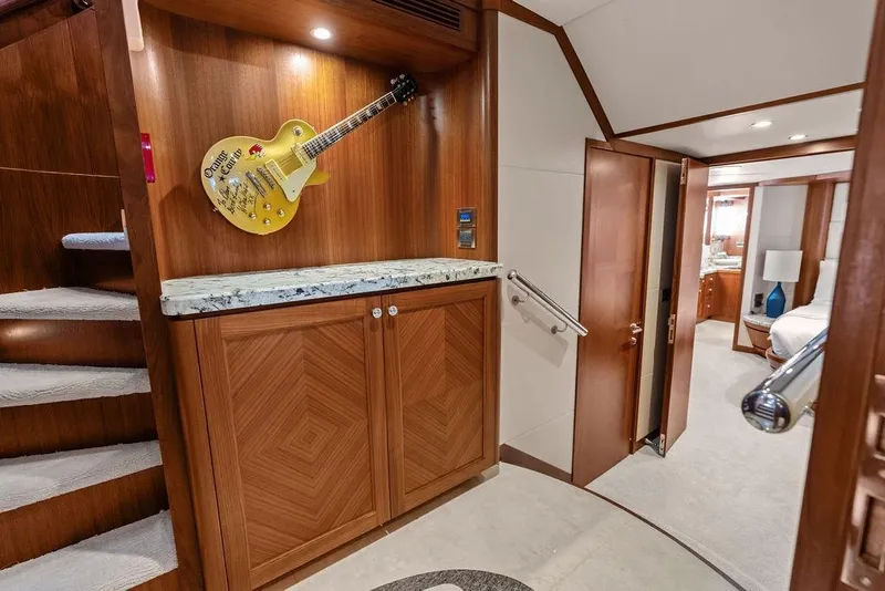 Slide: The Image of Luxurious interior of 2012 Ocean Alexander 90 Skylounge Motoryacht with decorative guitar display. - 67