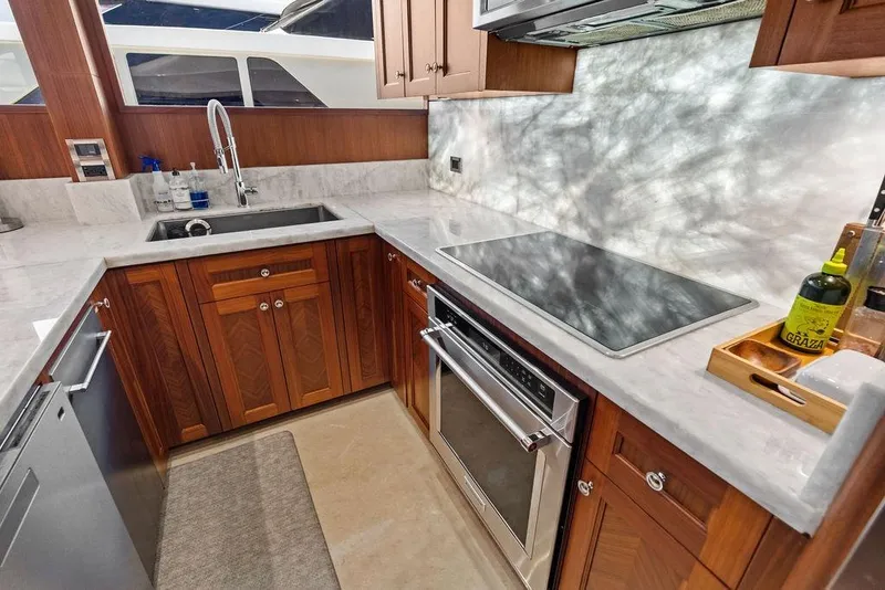 Slide: The Image of Luxurious kitchen in 2012 Ocean Alexander 90 Skylounge Motoryacht with marble countertops. - 50