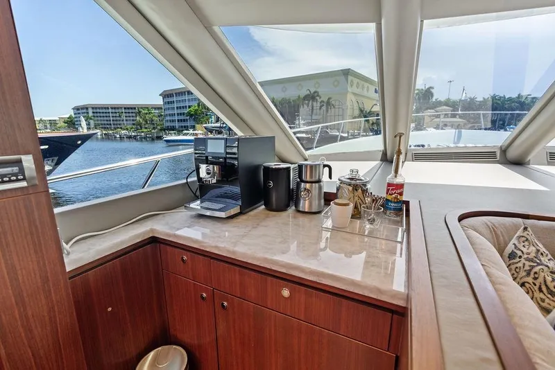 Slide: The Image of Luxurious coffee station on 2012 Ocean Alexander 90 Skylounge Motoryacht with marina view. - 52